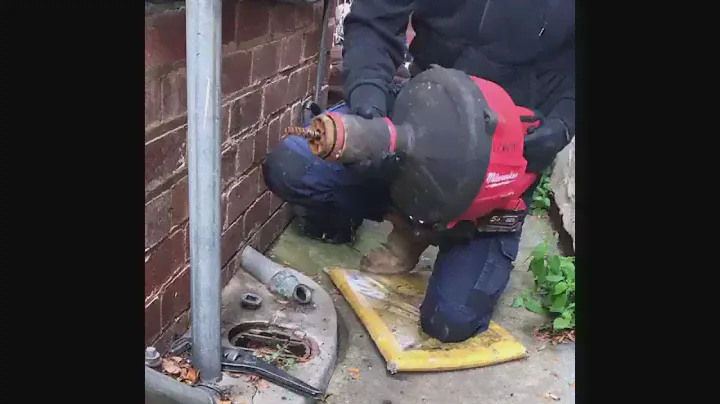Milwaukee M18 Power Feed Drain Cleaner in action